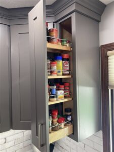 Slide out top cupboard spice organizer